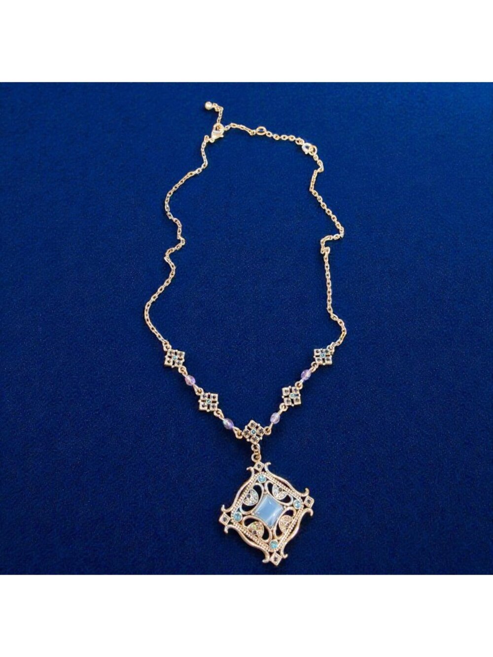 Vintage AVON NR Nina Ricci Era Blue Cat’s Eye Filigree Medallion Necklace 16"